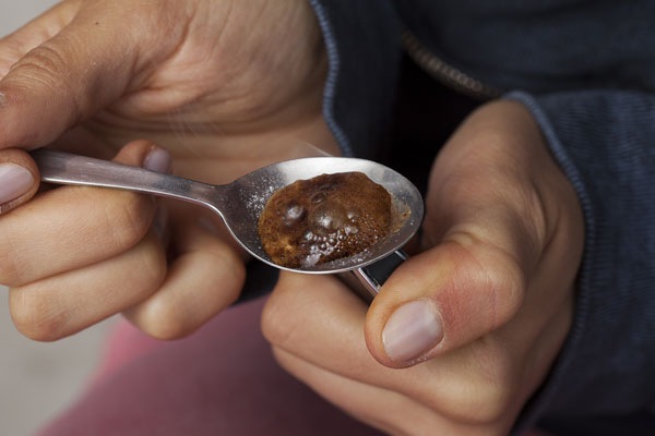 Cooking heroin in a spoon